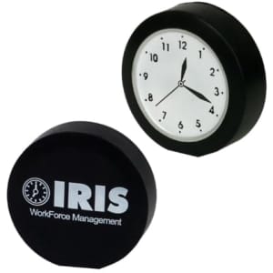 A black clock-shaped stress reliever with a white clock face and a logo on one side.