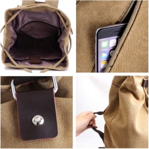 A brown canvas bucket backpack with a zippered compartment and inner pocket for a phone. It features a metal logo and a snap closure.