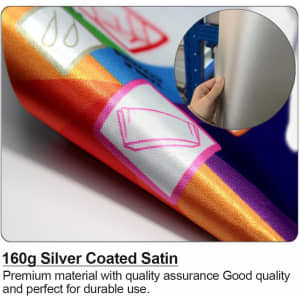 A close-up of 160g silver coated satin fabric with vibrant colours and a person's hand holding it.