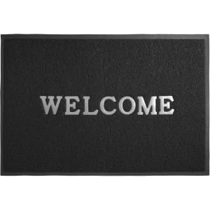 A black floor mat featuring the word "WELCOME" in a debossed design, showcasing its textured surface.