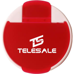 A round pill box in red and white with a branded logo on the front.