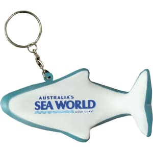 A white dolphin-shaped keyring stress reliever with a turquoise outline and a logo.
