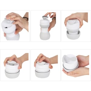 A drink bottle with a collapsible design, shown in white, featuring a secure lid and a hand demonstrating its use.