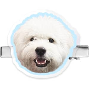 A custom shape acrylic hair clip featuring a smiling white dog face with a light blue border.