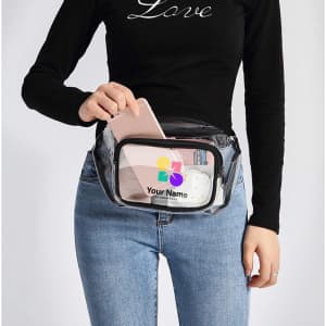 A clear fanny pack with a transparent front, featuring a phone, charging cable, and a logo. It has a black trim.