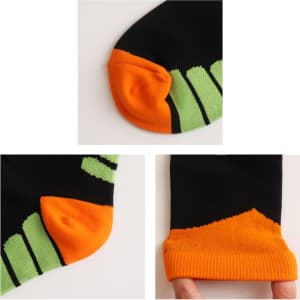 Crew sport socks featuring a black base with orange and green accents, including contrasting toe and cuff designs.