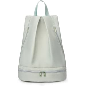 A pale green backpack with a dual zipper design, featuring a handle and a logo on the front.