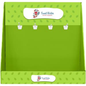 A green corrugated cardboard display with hooks for hanging items, featuring a logo at the top.