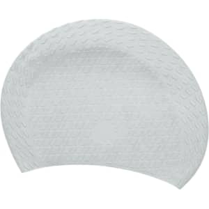 A white silicone swimming cap with a textured surface and a circular logo in the centre.