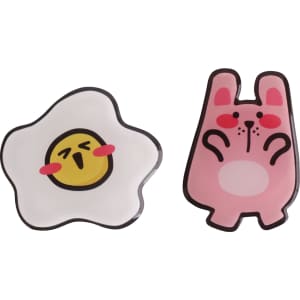 A pink rabbit-shaped acrylic phone pop holder and a white egg-shaped holder with a smiling face, both featuring bold outlines.