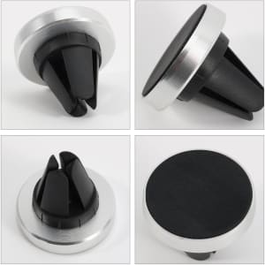 A clip-on car phone holder in black and silver, featuring a textured surface and air vent attachment design.