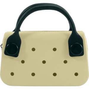 A mini handbag in cream with black handles and ventilation holes. It features a simple, modern design.