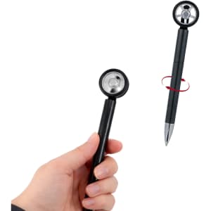 A black fidget spin tire-shaped pen being held in a hand, featuring a shiny spinning wheel design.
