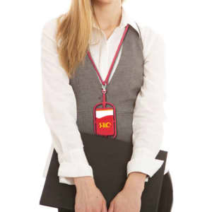 A phone holder with a red silicone lanyard is worn around the neck, attached to a card holder against a grey outfit.