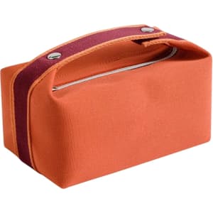 An orange portable canvas cosmetic bag with a maroon strap and a zip closure. It features a simple, rectangular design.