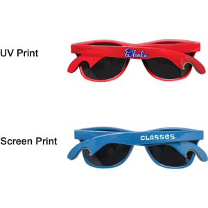 A drink bottle opener designed as sunglasses in red and blue with dark lenses and a logo on each.