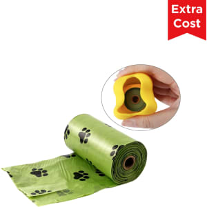 A green roll of dog poop bags with black paw prints and a yellow bone-shaped dispenser.
