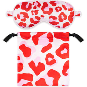 A satin sleep mask in red and pink leopard print, accompanied by a matching drawstring pouch.