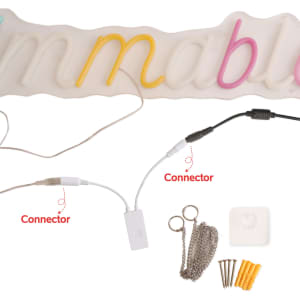 A collection of LED sign connectors in various colours, including yellow, pink, and white, with mounting accessories.