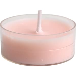 A pink tealight candle in a clear holder, featuring a simple design and a centrally placed wick.