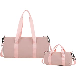 A pink bucket duffle bag with wide straps, featuring a large bag and a smaller matching bag.
