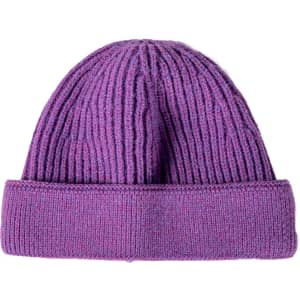 A purple round beanie featuring a ribbed texture and a folded cuff, with a branding logo present.