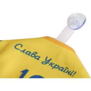A yellow custom mini jersey with a clear suction cup for hanging, featuring a logo and text.