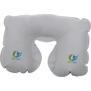 An inflatable travel pillow in white, featuring rounded edges and a logo on one side.