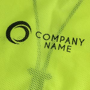 A bright yellow hi-vis vest with reflective tapes and functional pockets, featuring a company logo.