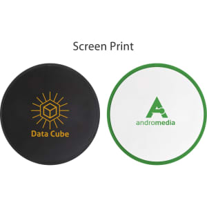 A foldable frisbee in black and white with green trim, featuring screen-printed logos.