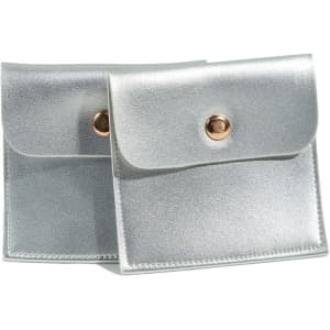 A silver PU leather jewelry pouch with a snap closure, featuring a shiny finish and a metallic button.