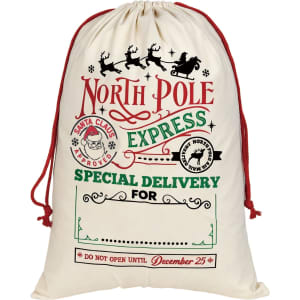 A cream-coloured drawstring bag with festive graphics and red accents, featuring a logo and holiday-themed text.