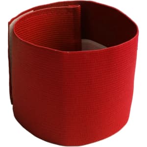 A red stretchy armband featuring a simple design with a textured finish and an interior lining.