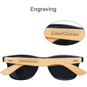 Bamboo sunglasses with black lenses and engraved wooden arms featuring a logo.