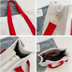 A canvas grocery shopping bag in white with red handles, featuring a zippered compartment and interior lining.