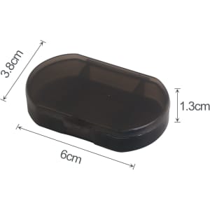 A black pill box with three compartments, measuring 6 cm by 3.8 cm by 1.3 cm. It features a secure closure.