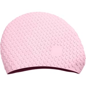 A pink silicone swimming cap featuring a textured surface with water droplets and a logo.