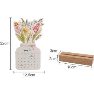A flowers-themed desk calendar features a floral design on top, with a wooden base for support.
