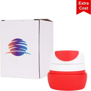 A collapsible silicone coffee travel cup in red and white, displayed with its packaging featuring a logo.