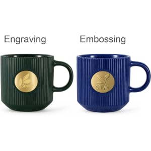 A green ceramic mug with a bronze medal and a blue ceramic mug with a bronze medal, both featuring ribbed designs.
