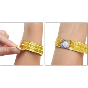 A yellow disposable holographic PVC wristband with a fastening mechanism, showcased on a person's wrist.