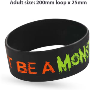 A black silicon wristband featuring debossed text filled with orange and green colour. It has a logo.
