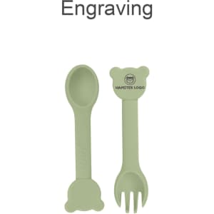 A bear-shaped silicone kids cutlery set in soft green, featuring a spoon and fork, with a small logo.