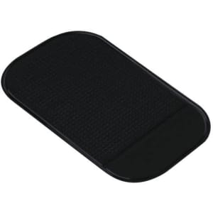 A black dashboard mat with a textured surface, featuring a smooth edge and a rounded shape.
