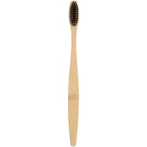A large bamboo toothbrush with a natural bamboo handle and black bristles, featuring a logo on the handle.