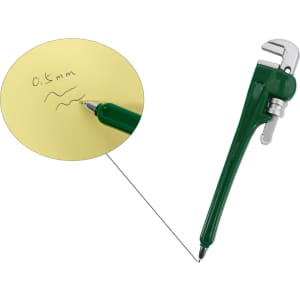 A green pipe wrench-shaped ballpoint pen rests next to a yellow notepad with handwritten notes.