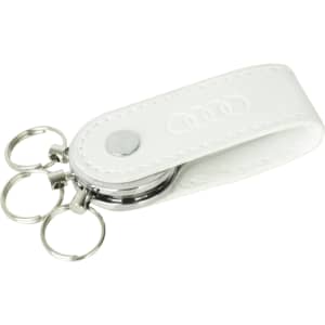 A white PU leather keychain with a swivel drive and three metal key rings, featuring an embossed logo.