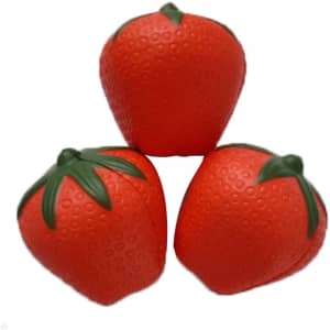 Three red strawberry-shaped stress relievers with green leaves on top, featuring a textured surface.