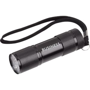 A black portable LED torch with a textured surface and a wrist strap, featuring a logo.