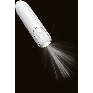 A white handheld mini fan with a built-in flashlight emitting light, featuring a simple button design.